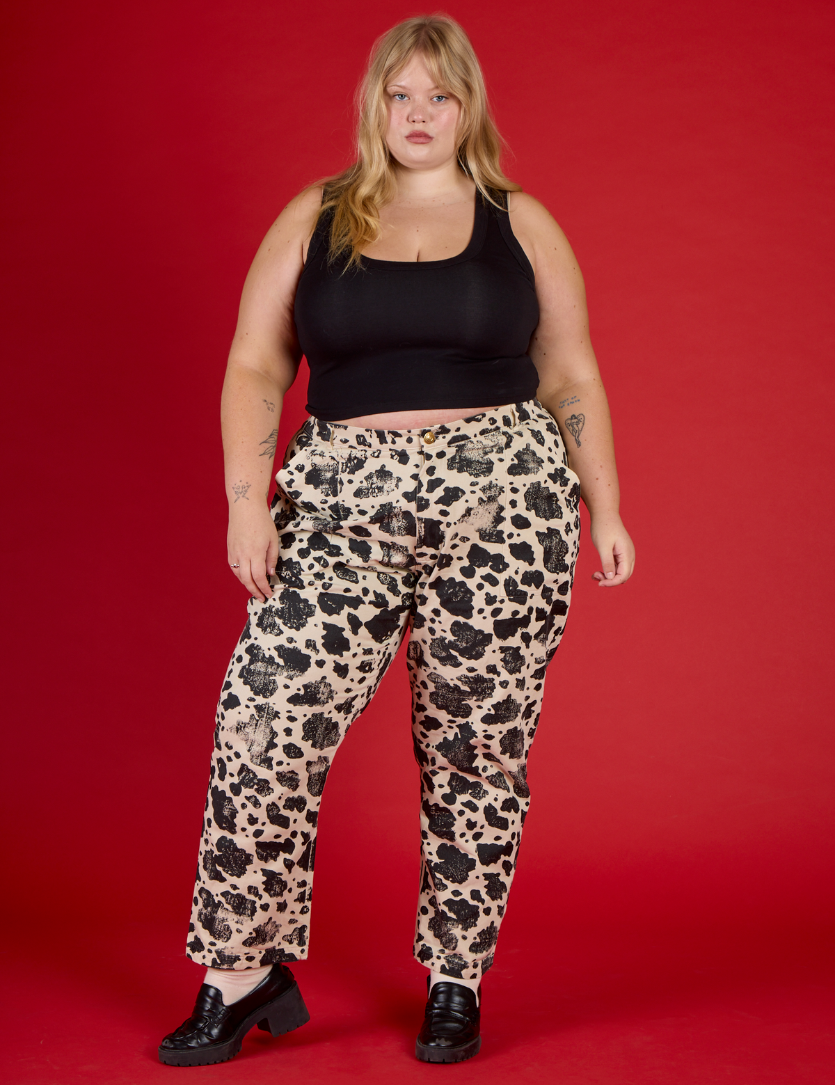 Juliet is 5'7" wearing 2XL Cow Work Pant with the Black Cropped Tank