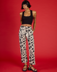 Kira is 5'10" wearing XS Cow Work Pant with the Black Cropped Tank