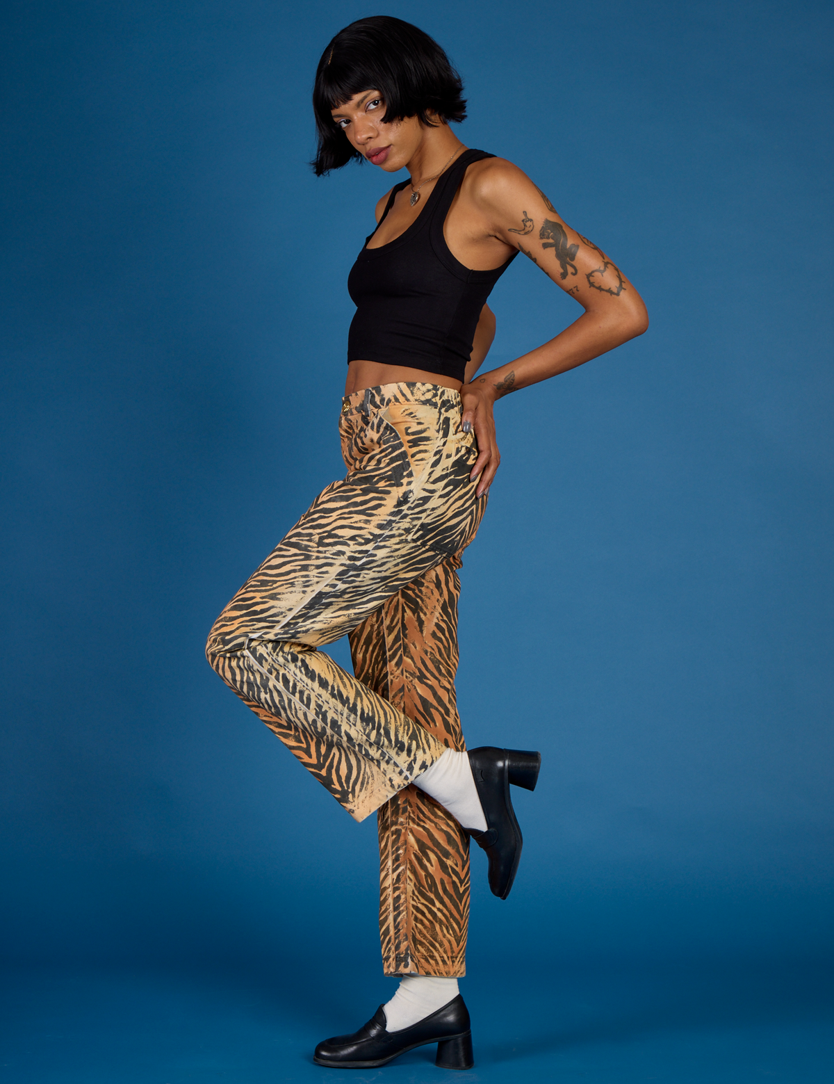 Side view of Kira wearing the Tiger Work Pant