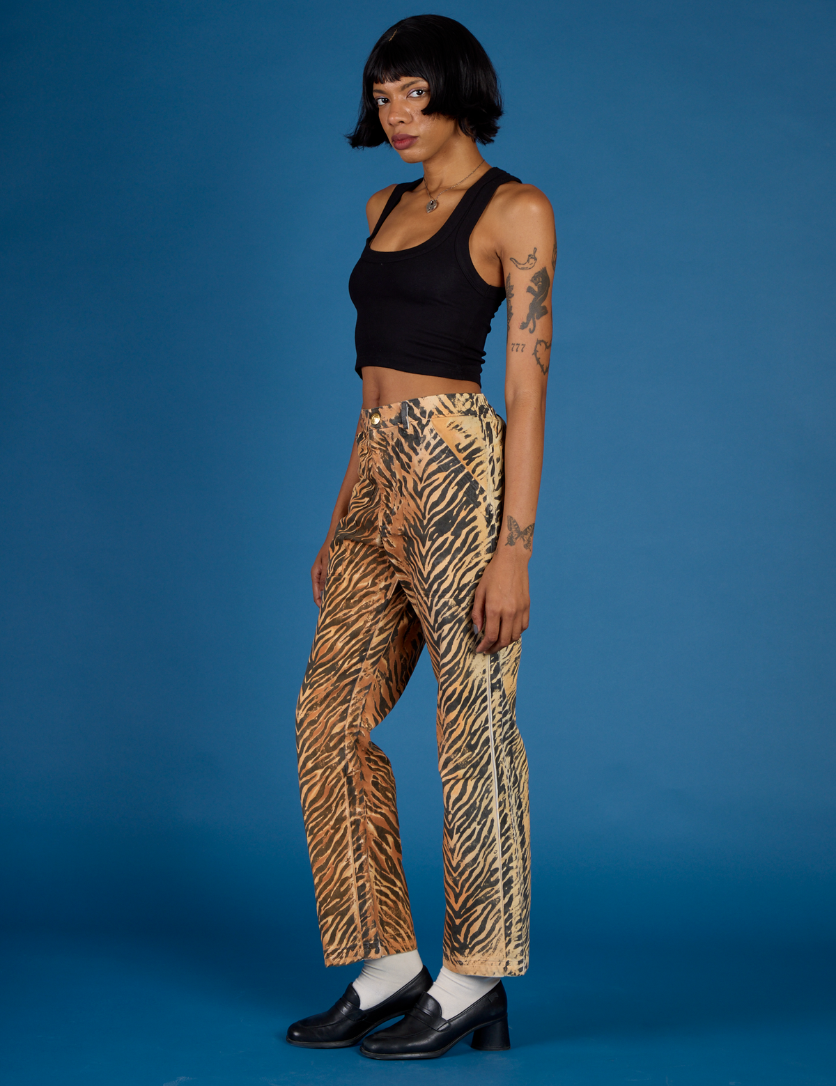 Kira wearing the Tiger Work Pant with the Black Cropped Tank