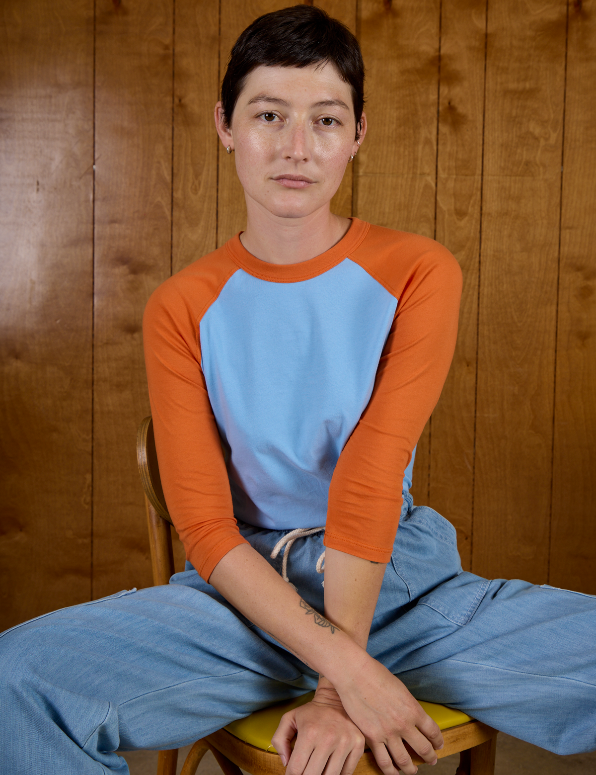 Alex wearing the Baby Blue/Orange Colorblock Raglan Tee