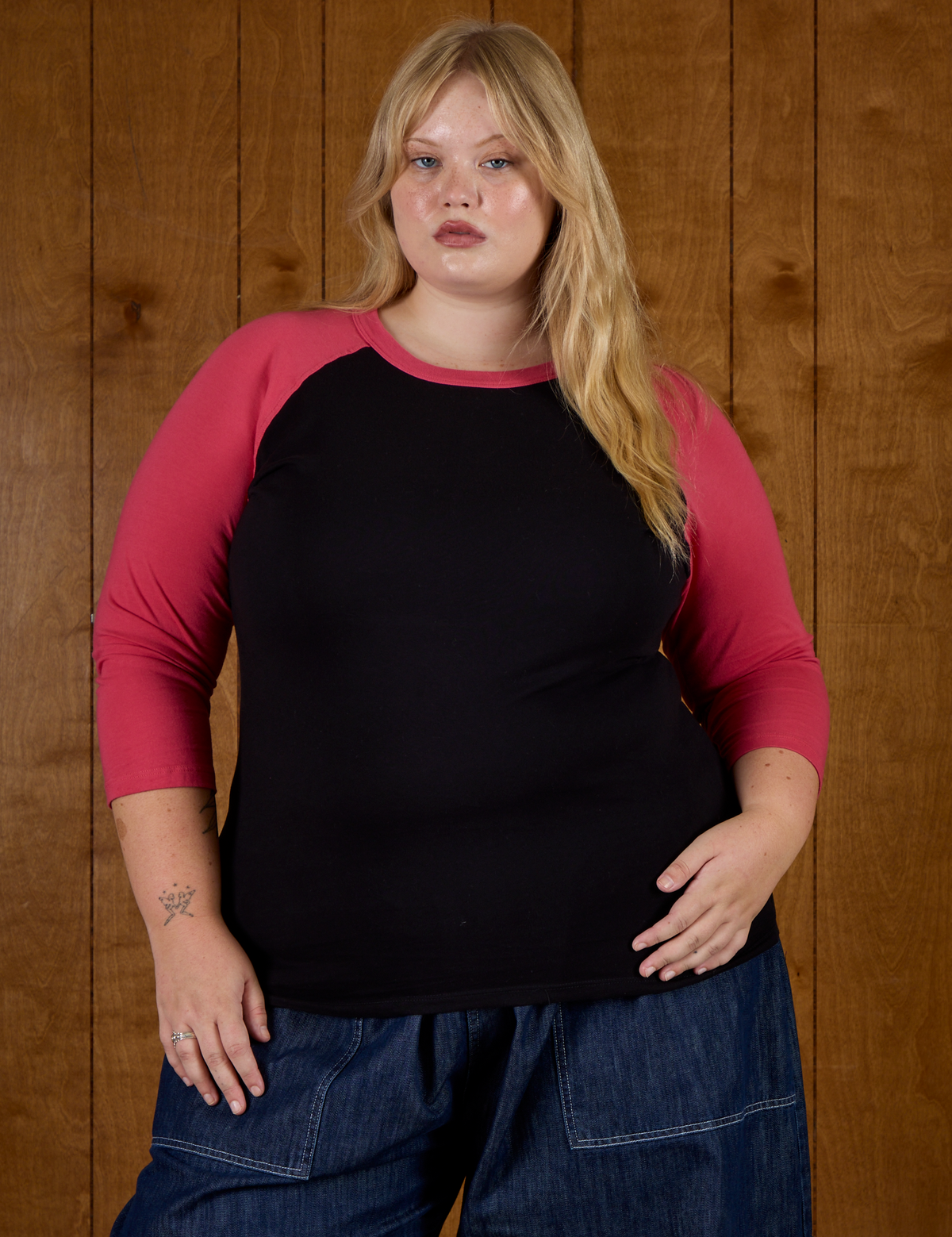 Juliet wearing the Black/Pink Colorblock Raglan Tee