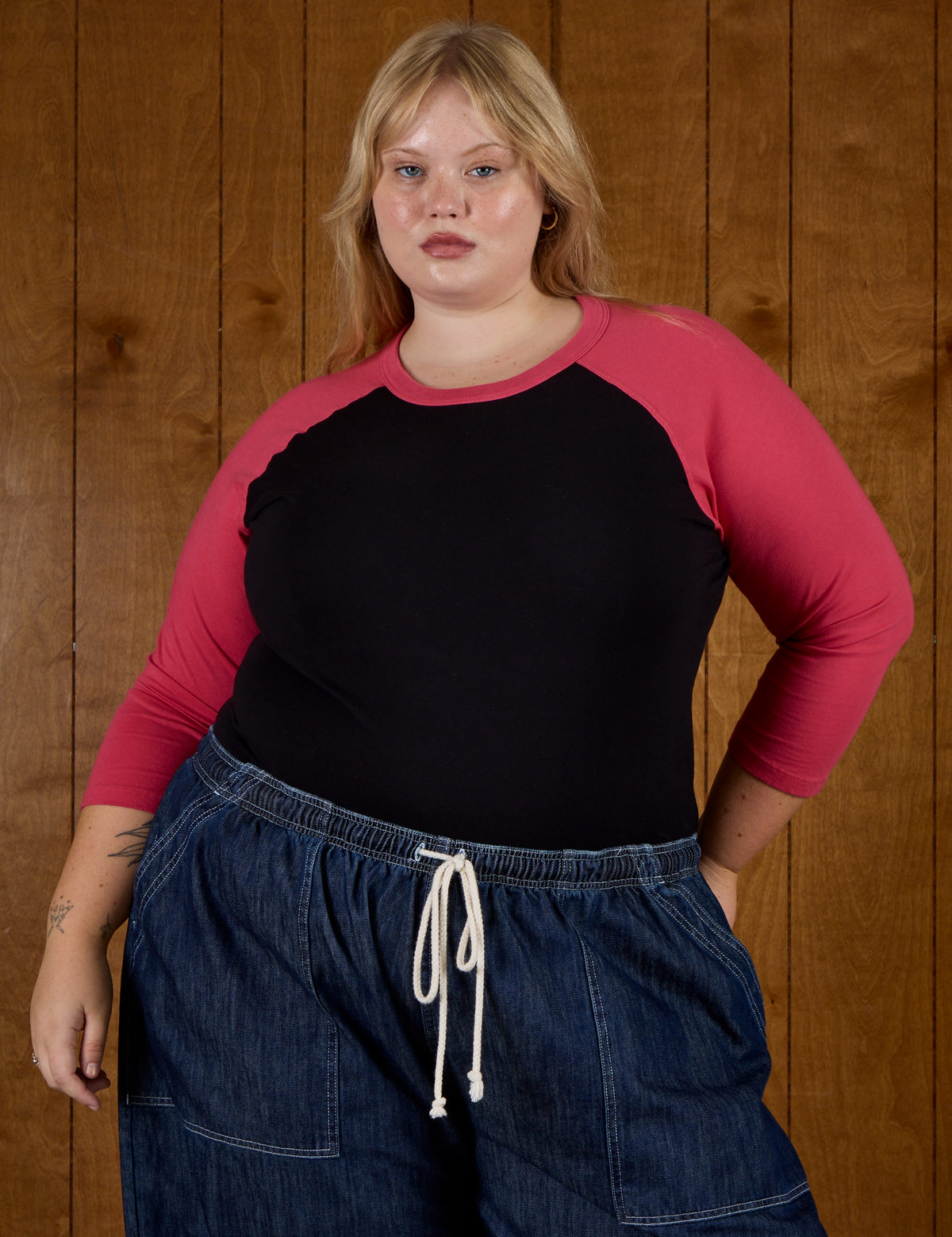 Juliet wearing the Black/Pink Colorblock Raglan Tee