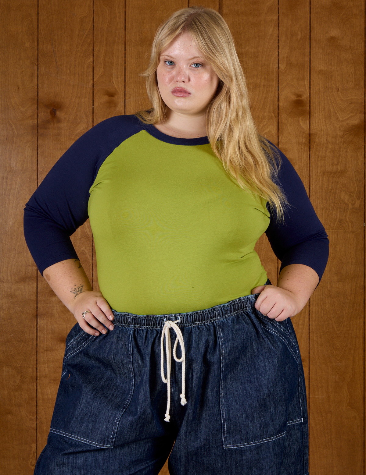 Juliet wearing the Gross Green/Navy Colorblock Raglan Tee 