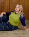 Juliet wearing  the Gross Green/Navy Colorblock Raglan Tee