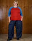 Juliet wearing the Mustang Red/Blue Colorblock Raglan Tee with Dark Wash Drop Pocket Pants