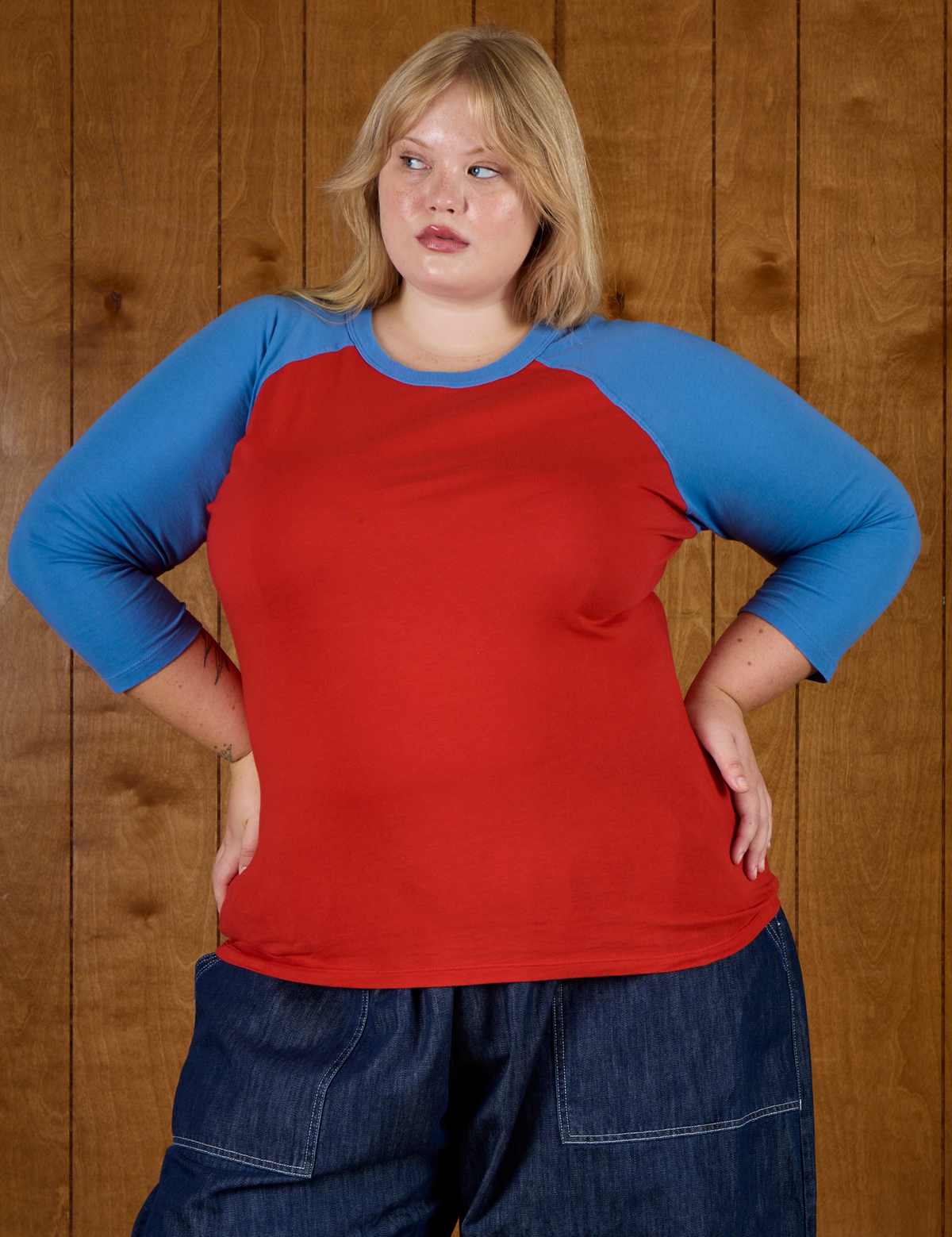 Close up of Juliet wearing the Mustang Red/Blue Colorblock Raglan Tee
