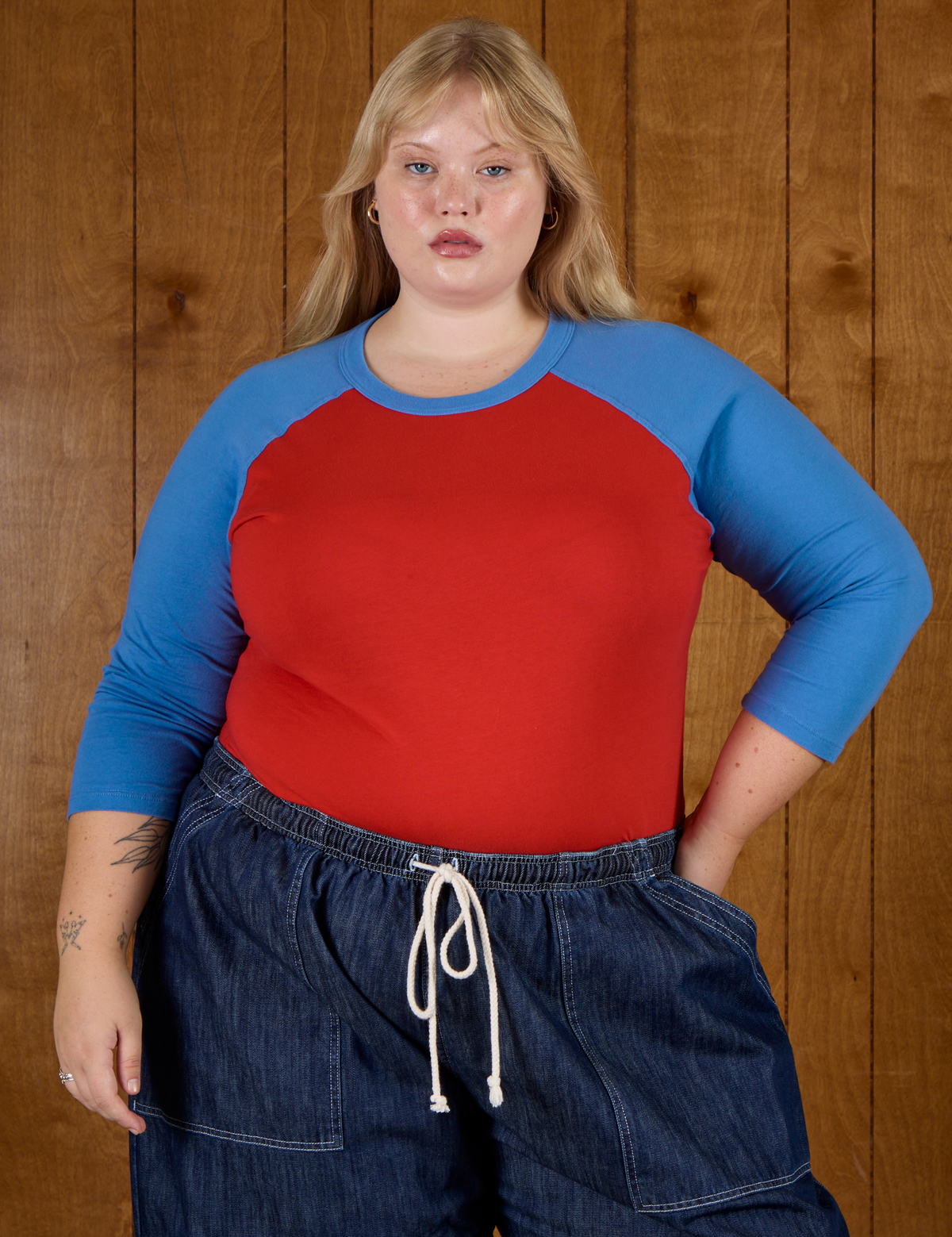 Juliet wearing the Mustang Red/Blue Colorblock Raglan Tee