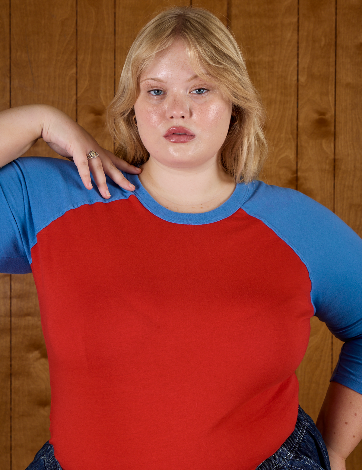 Close up of Juliet wearing the Mustang Red/Blue Colorblock Raglan Tee