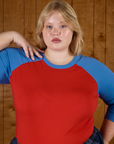 Close up of Juliet wearing the Mustang Red/Blue Colorblock Raglan Tee