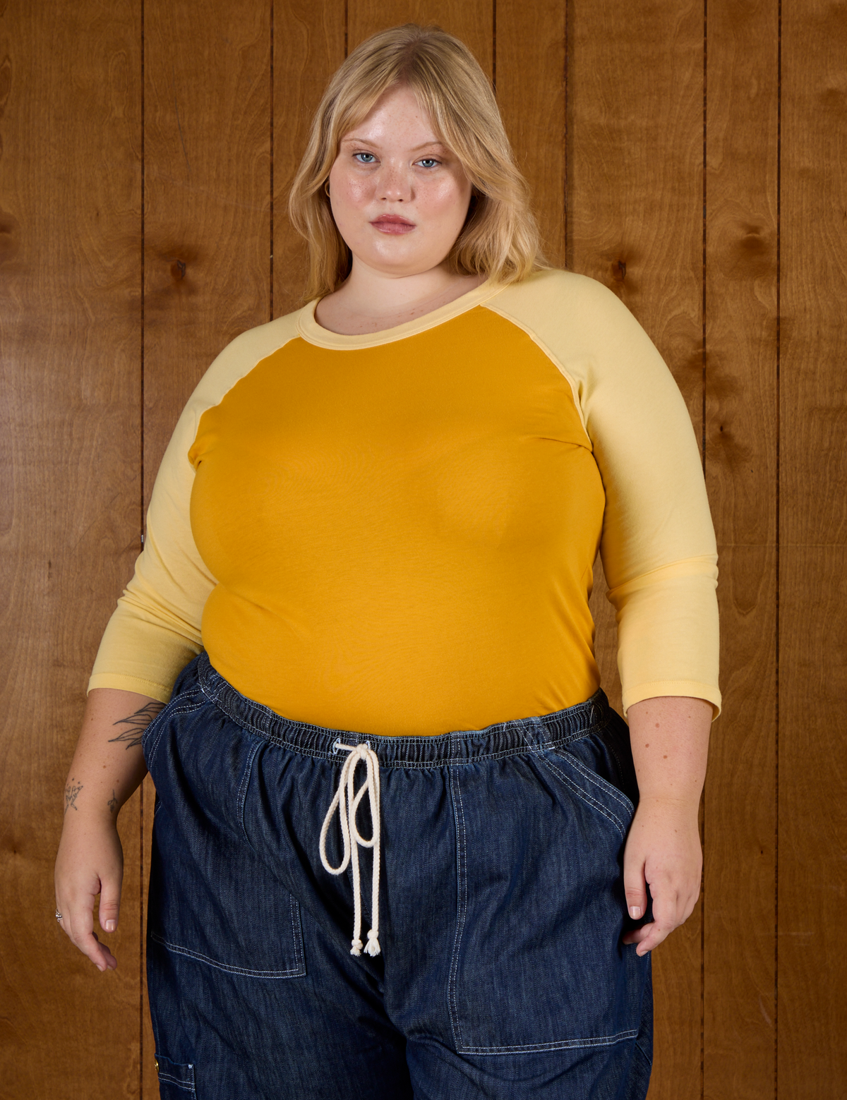 Juliet wearing the Mustard Yellow/Butter Raglan Tee