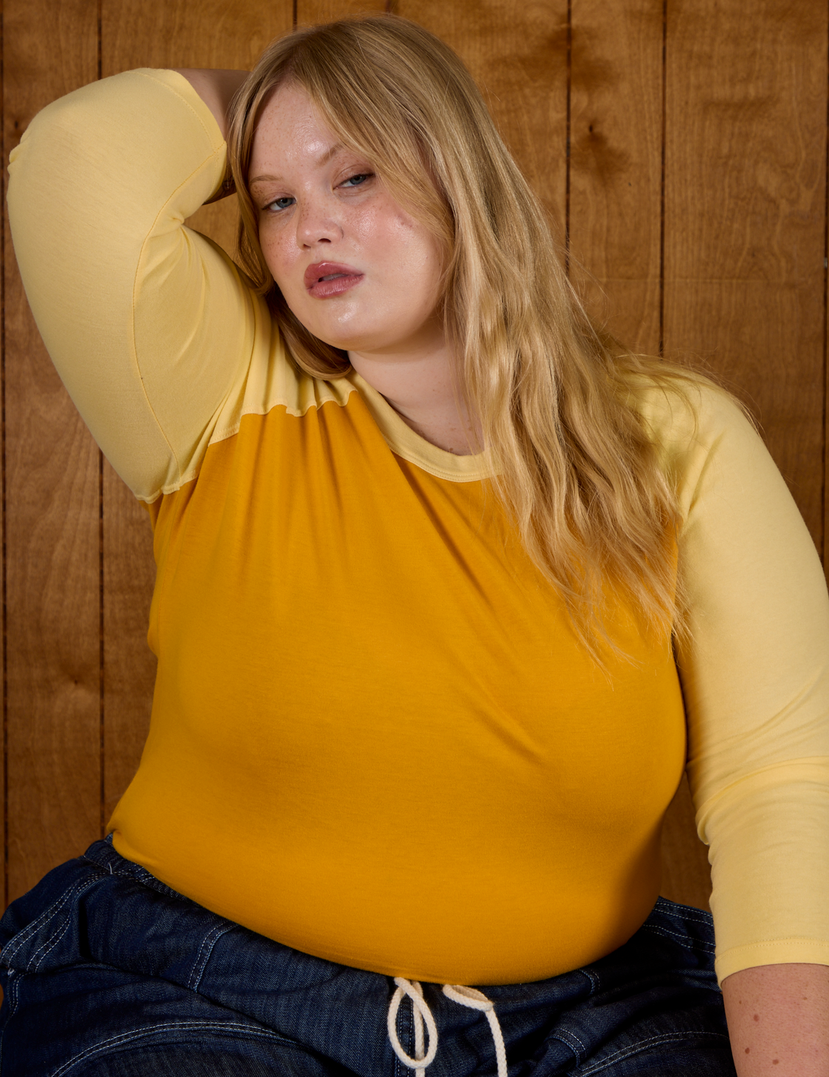 Close up of Juliet in the Mustard Yellow/Butter Raglan Tee