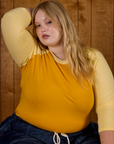 Close up of Juliet in the Mustard Yellow/Butter Raglan Tee