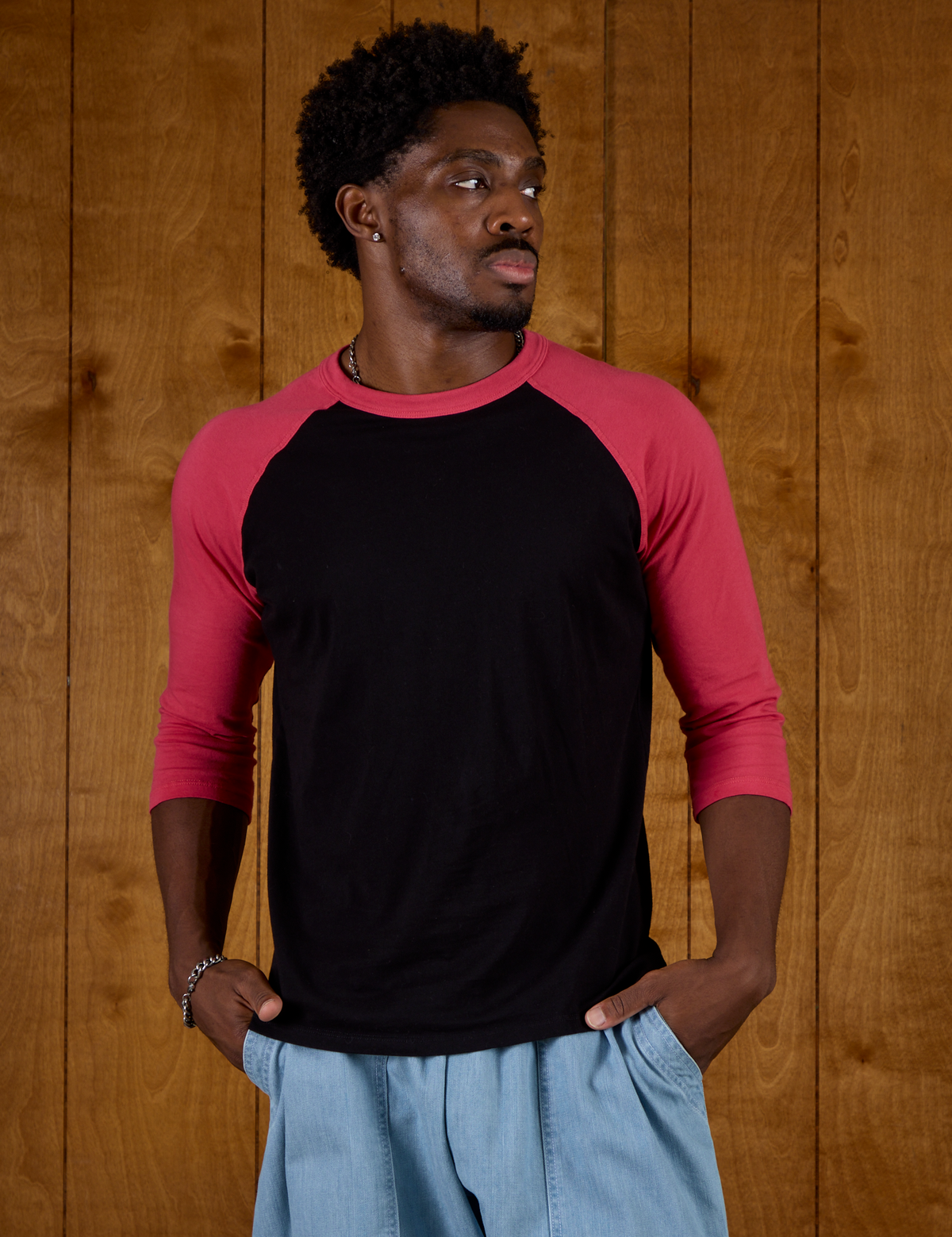 Isaac is 5'10 and wearing M Black/Pink Colorblock Raglan Tee