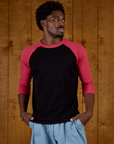 Isaac is 5'10 and wearing M Black/Pink Colorblock Raglan Tee
