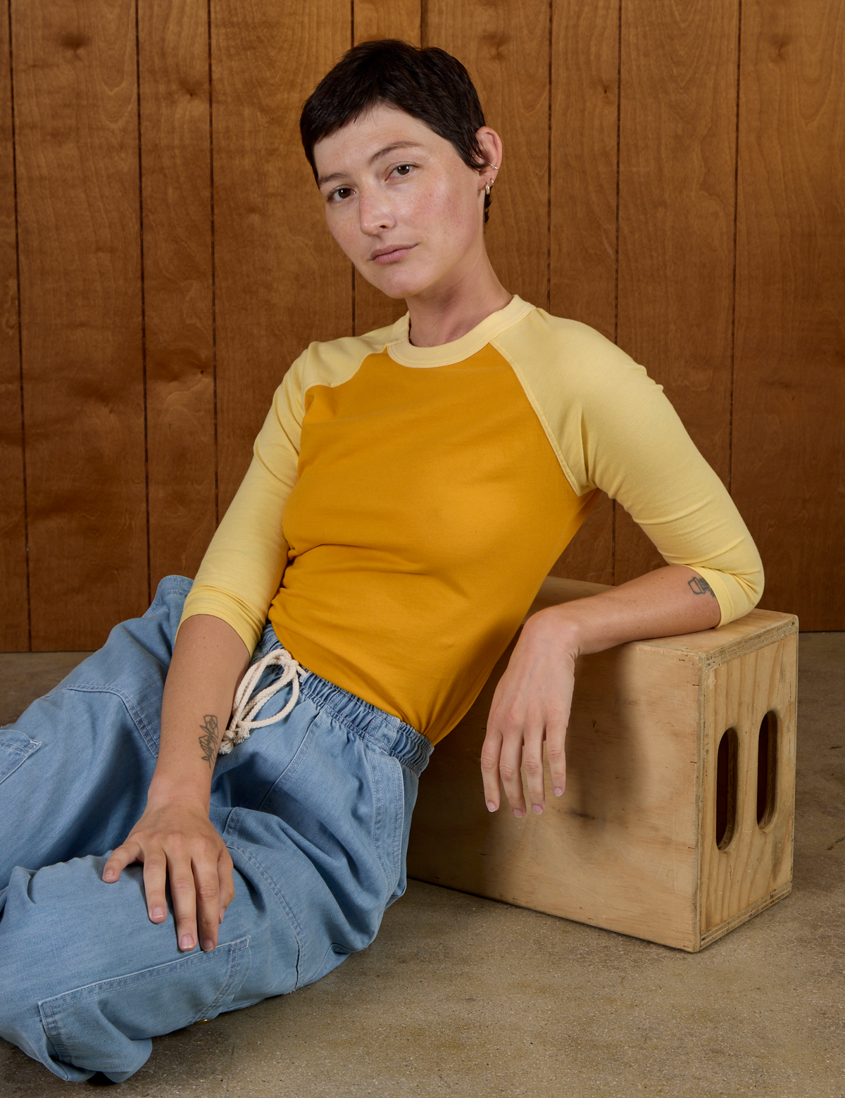 Alex in the Mustard Yellow/Butter Raglan Tee