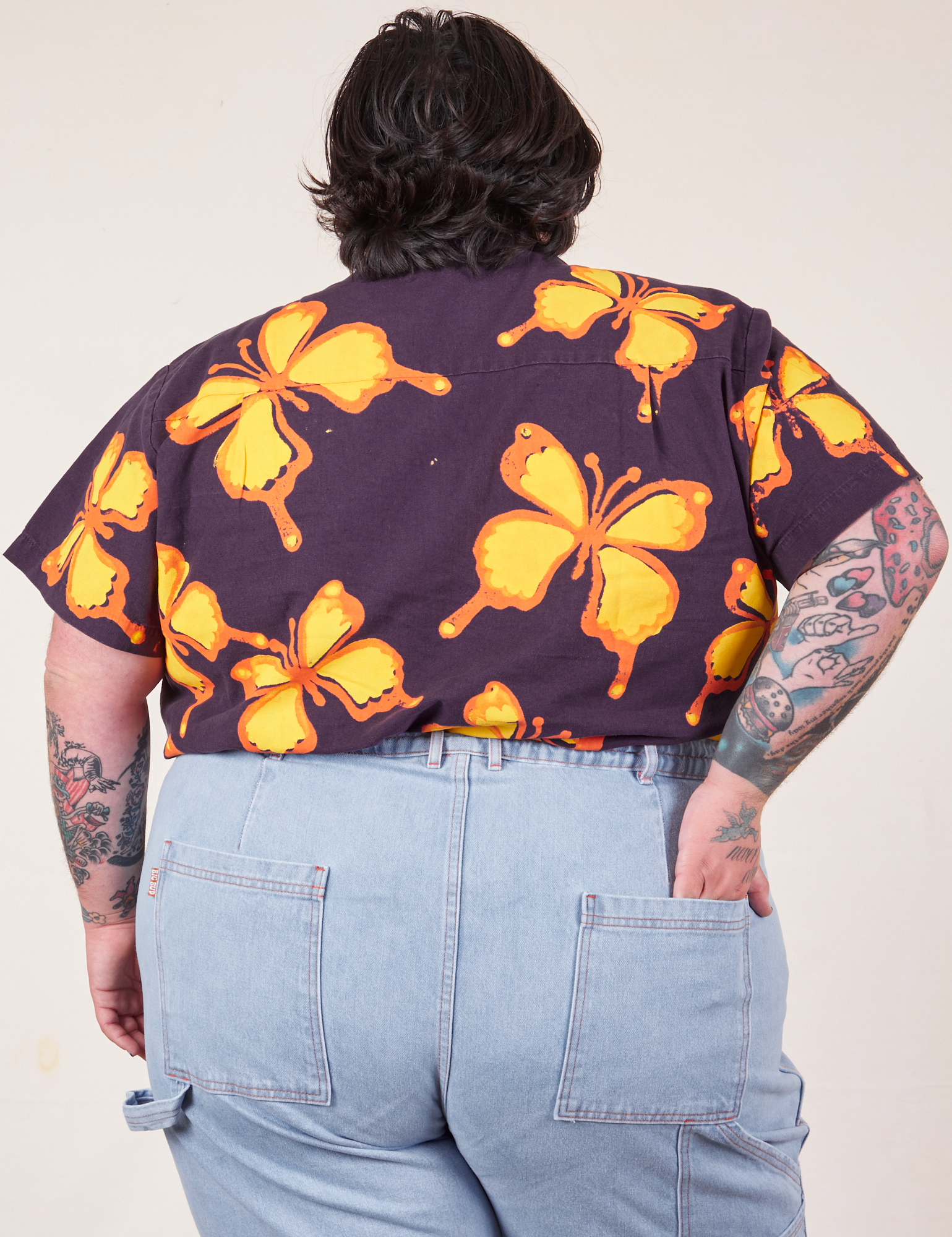 Back view of Icon Pantry Button-Up in Butterfly and light wash Carpenter Jeans worn by Sam