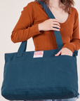 XL Zip Tote in Lagoon worn over shoulder of model