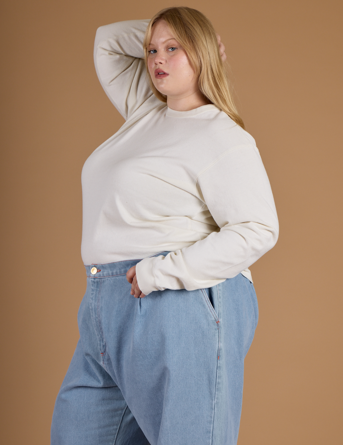 Angled side view of Juliet wearing the Vintage Tee White Long Sleeve Burly Tee