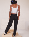 Back view of Long Heavyweight Trousers Basic Black and vintage off-white Cami on Jerrod