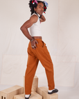 Angled side view of Heavyweight Trousers in Burnt Terracotta on Jerrod