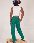 Back view of Heavyweight Trousers in Hunter Green and vintage off-white Sleeveless Turtleneck on Jerrod