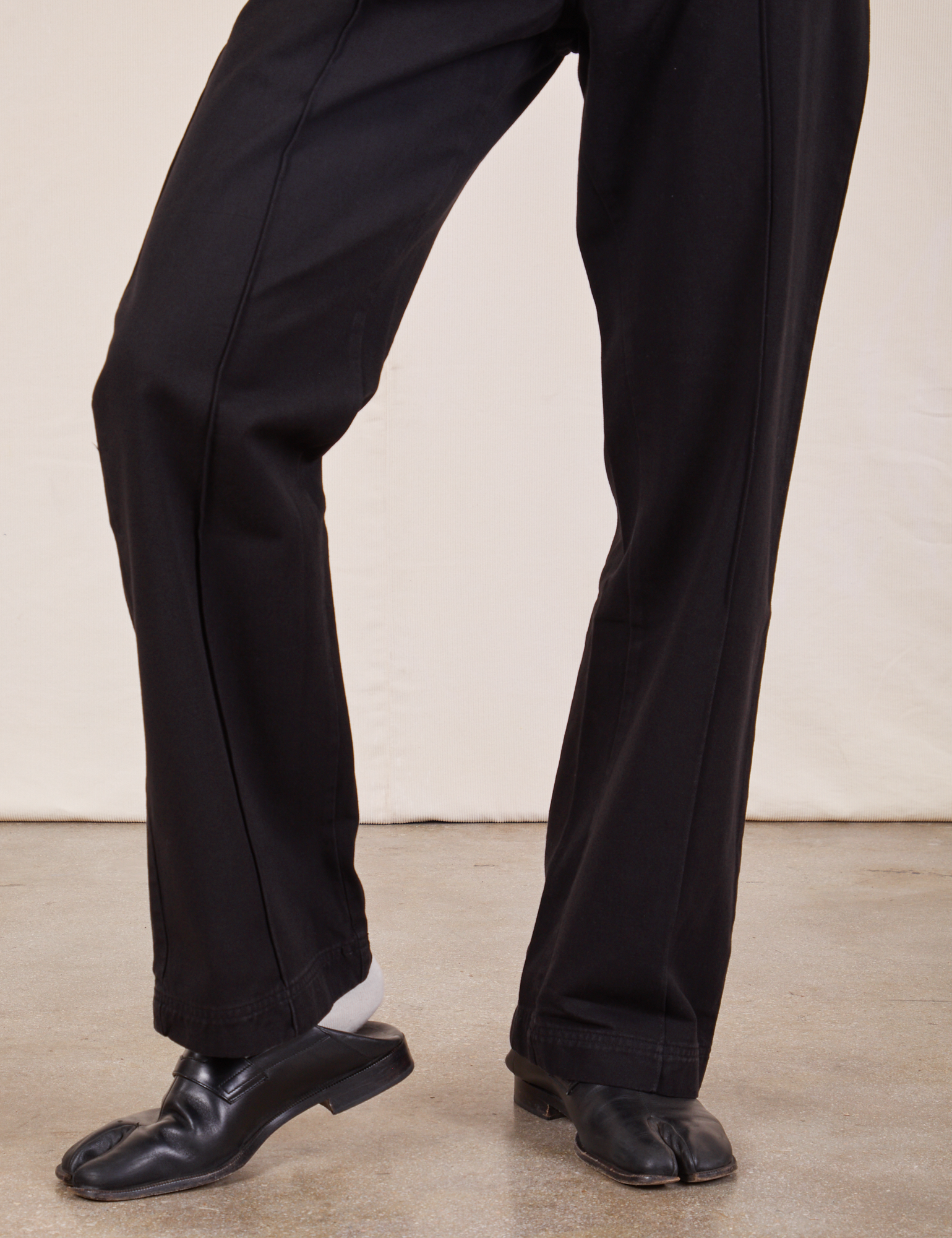 Western Pants in Basic Black pant leg close up on Jerrod