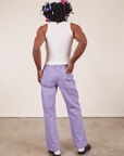 Back view of Western Pants in Faded Grape and vintage off-white Tank Top on Jerrod