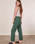 Work Pants in Dark Emerald Green side view on Allison wearing vintage off-white Tank Top