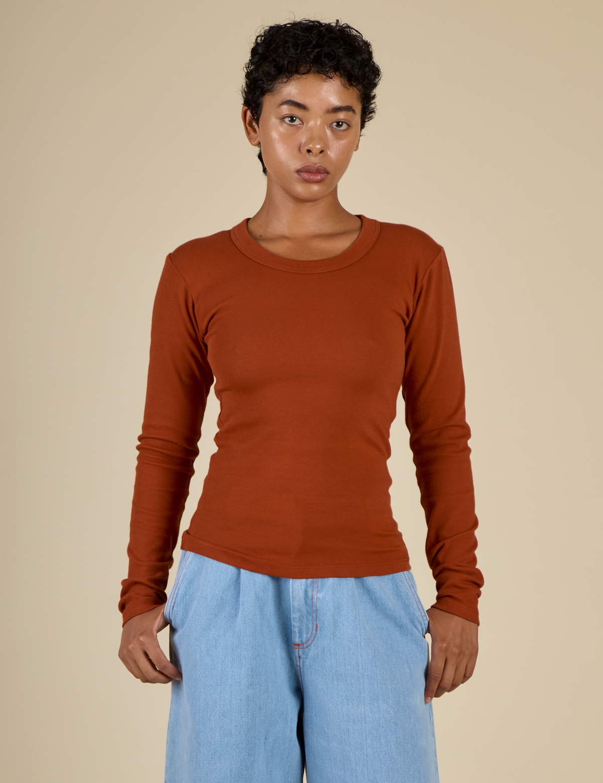 Mika is 5'3" and wearing P Burnt Terracotta Long Sleeve Baby Tee
