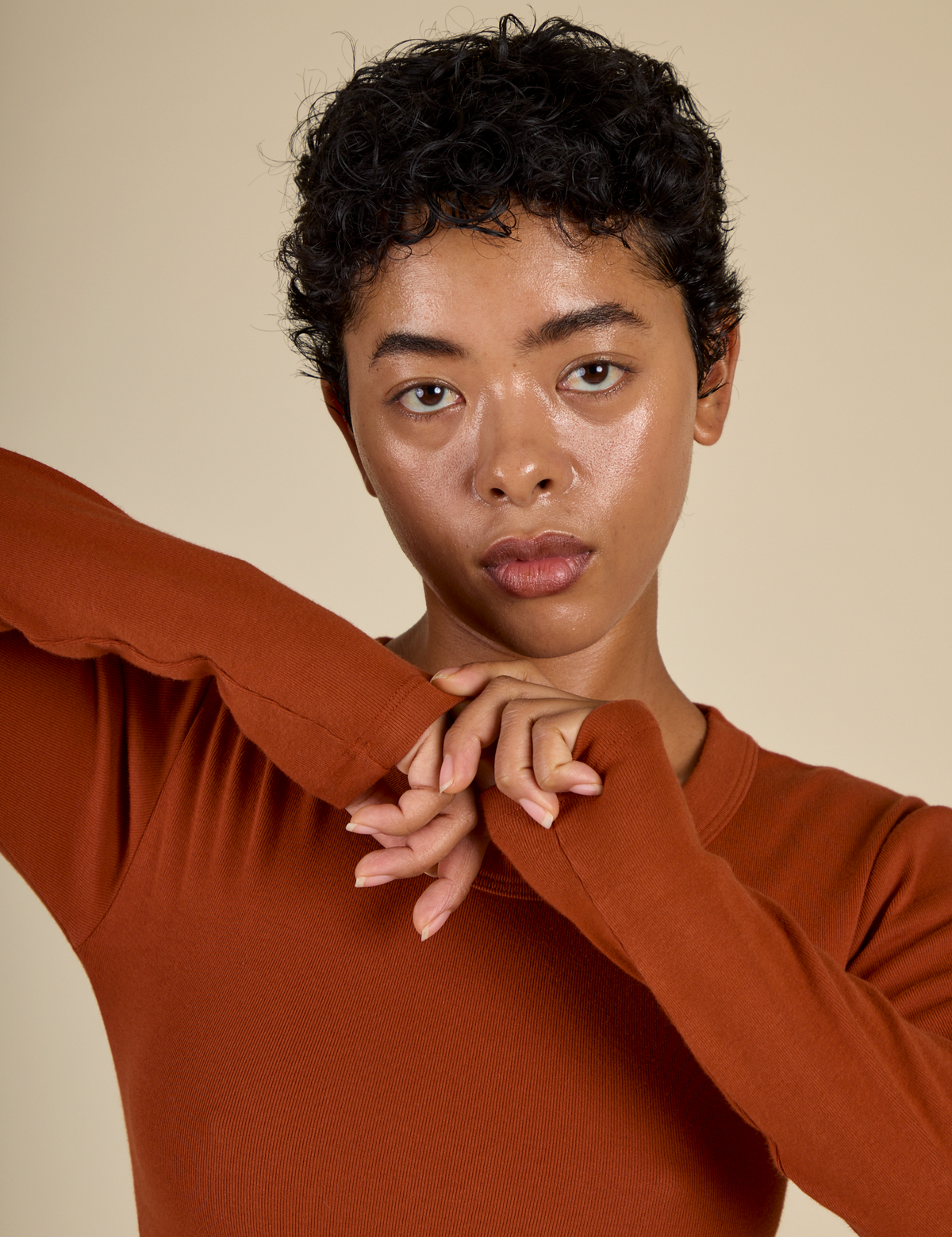 Close up of Mika in the Burnt Terracotta Long Sleeve Baby Tee