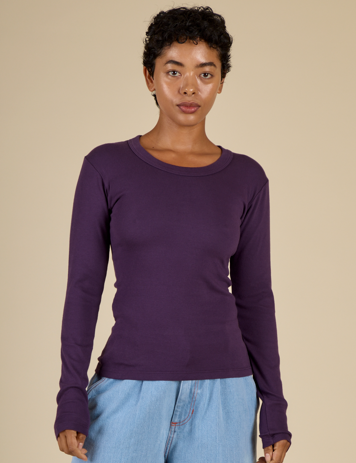 Mika is 5'3" and wearing P Nebula Long Sleeve Baby Tee