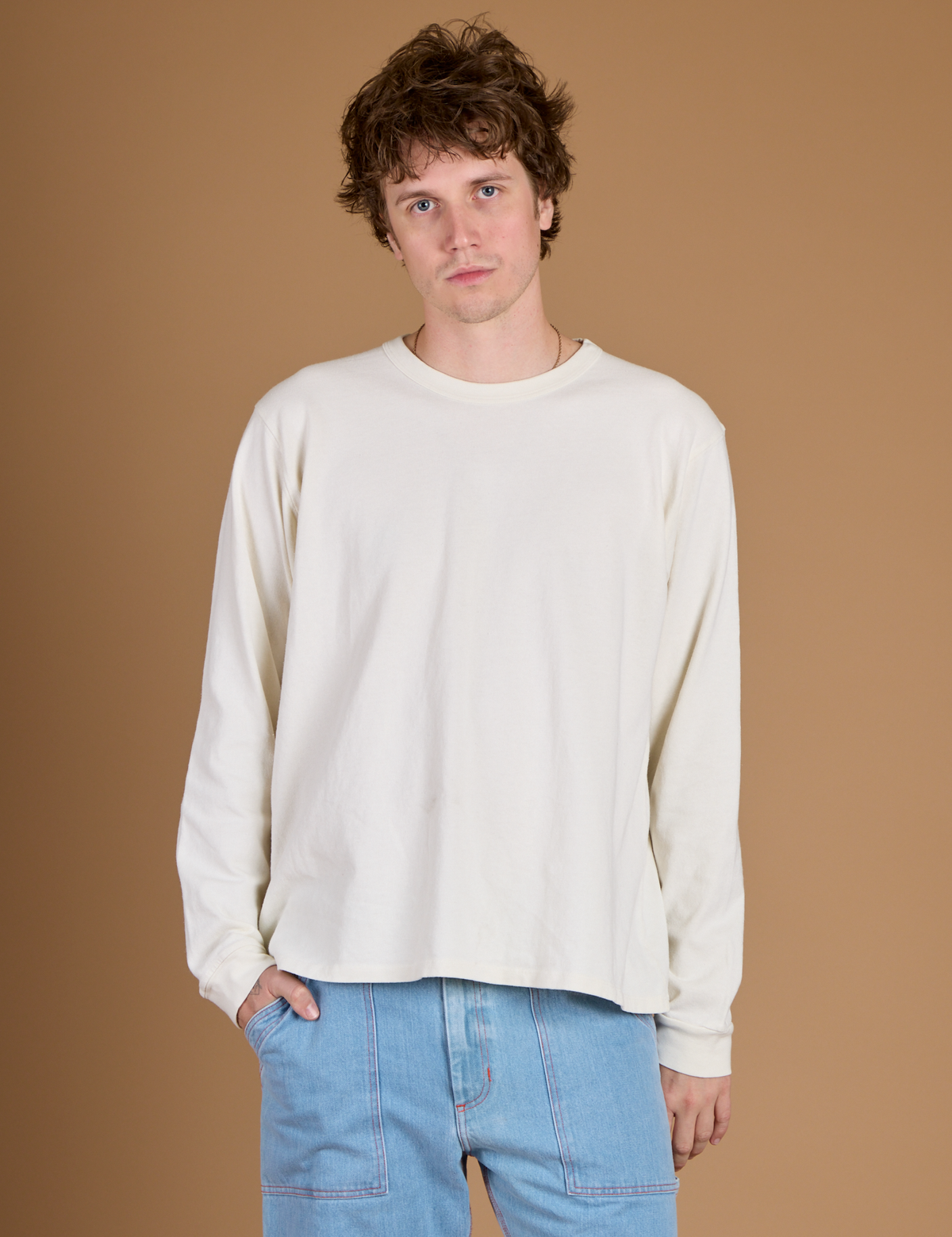 Quinn is 6'3" and wearing M Vintage Tee White Long Sleeve Burly Tee