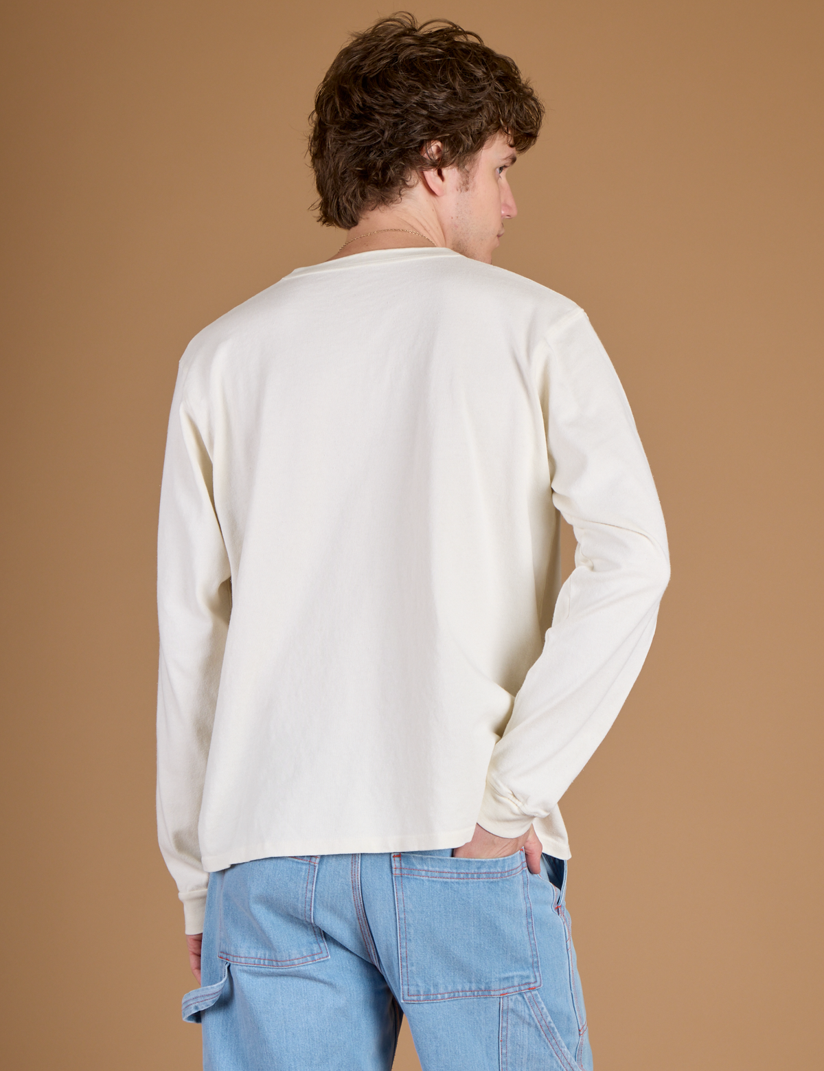Back view of the Vintage Tee White Long Sleeve Burly Tee on Quinn
