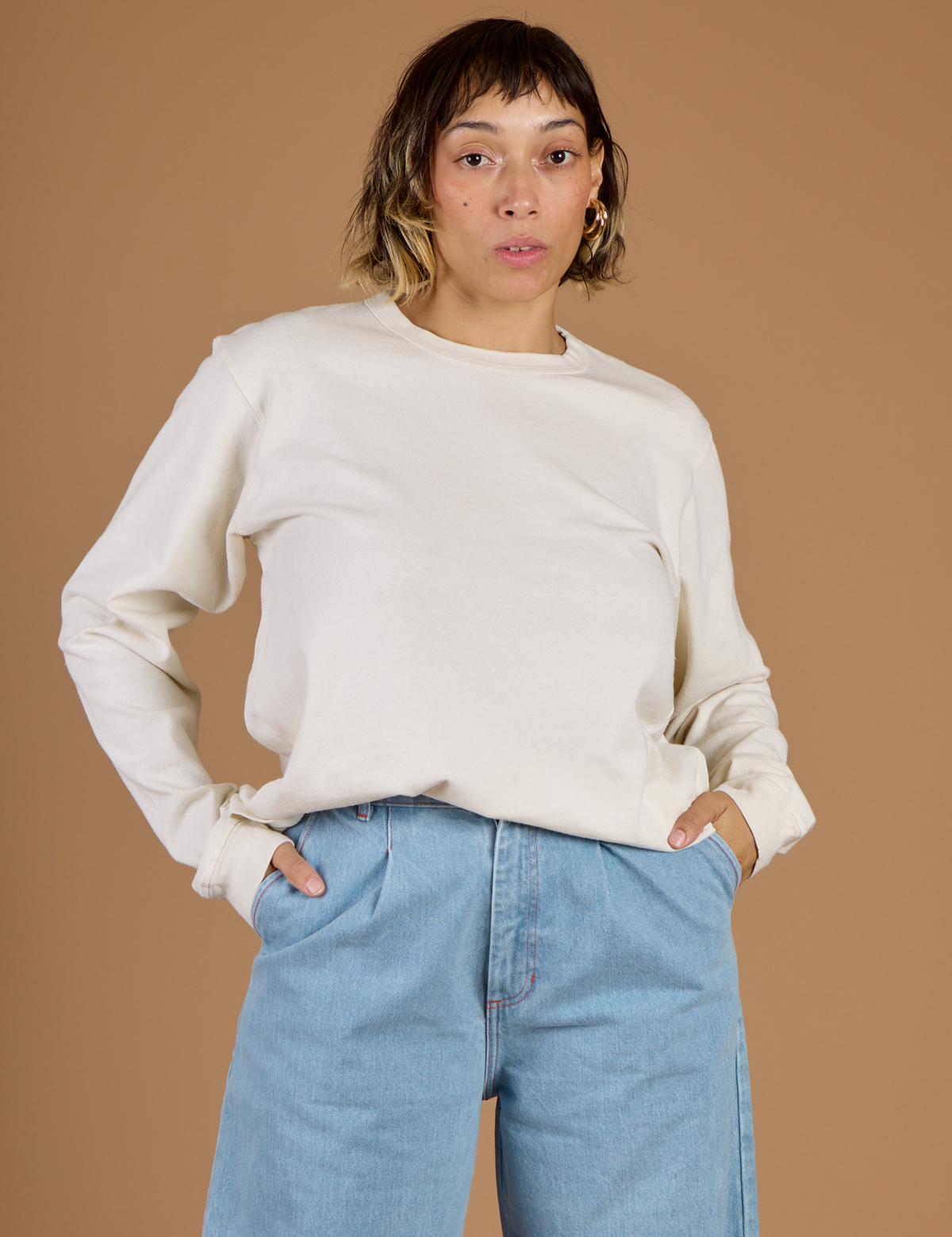 Tiara wearing the Vintage Tee White Long Sleeve Burly Tee tucked in