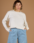 Tiara wearing the Vintage Tee White Long Sleeve Burly Tee tucked in