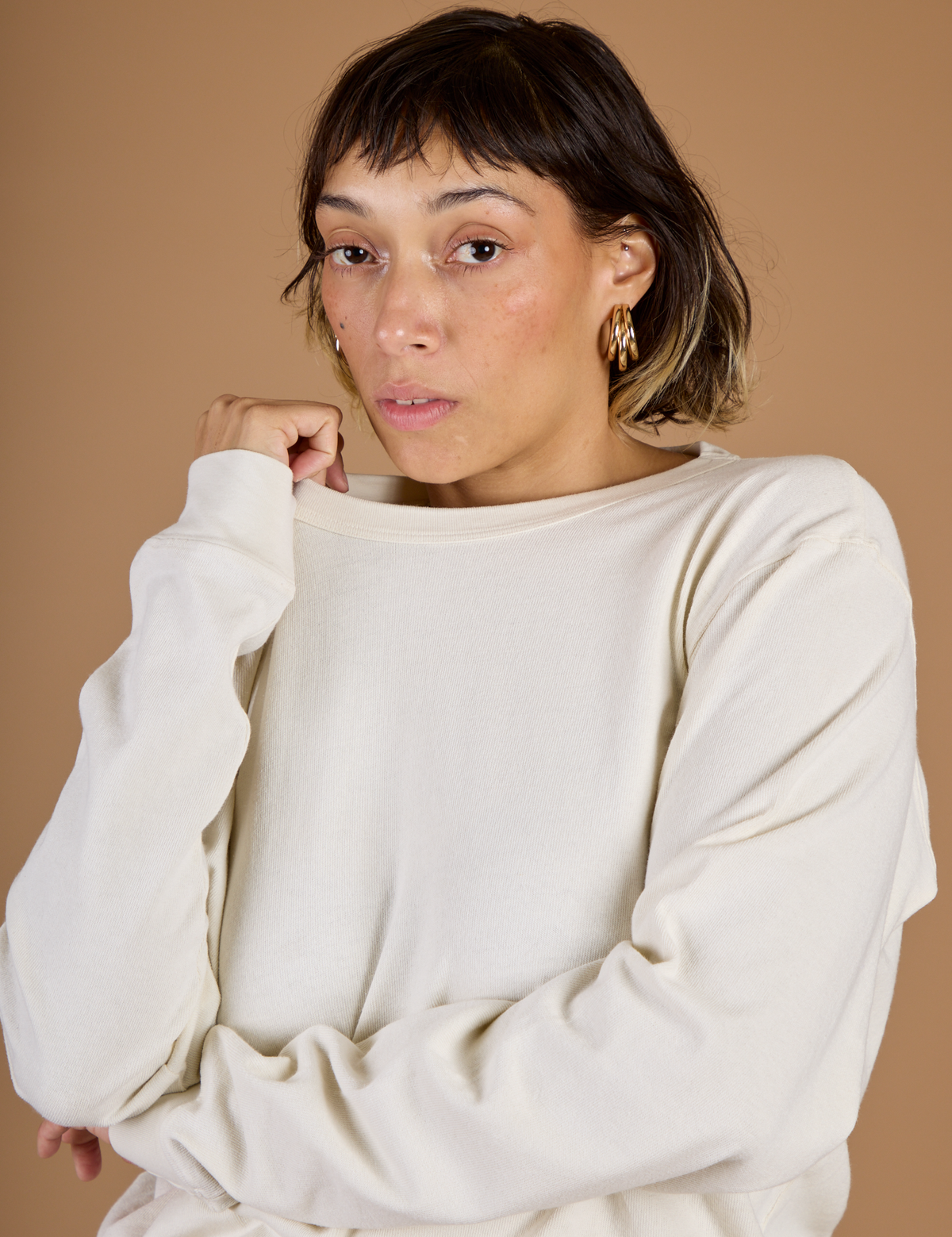 Close up of Tiara wearing the Vintage Tee White Long Sleeve Burly Tee