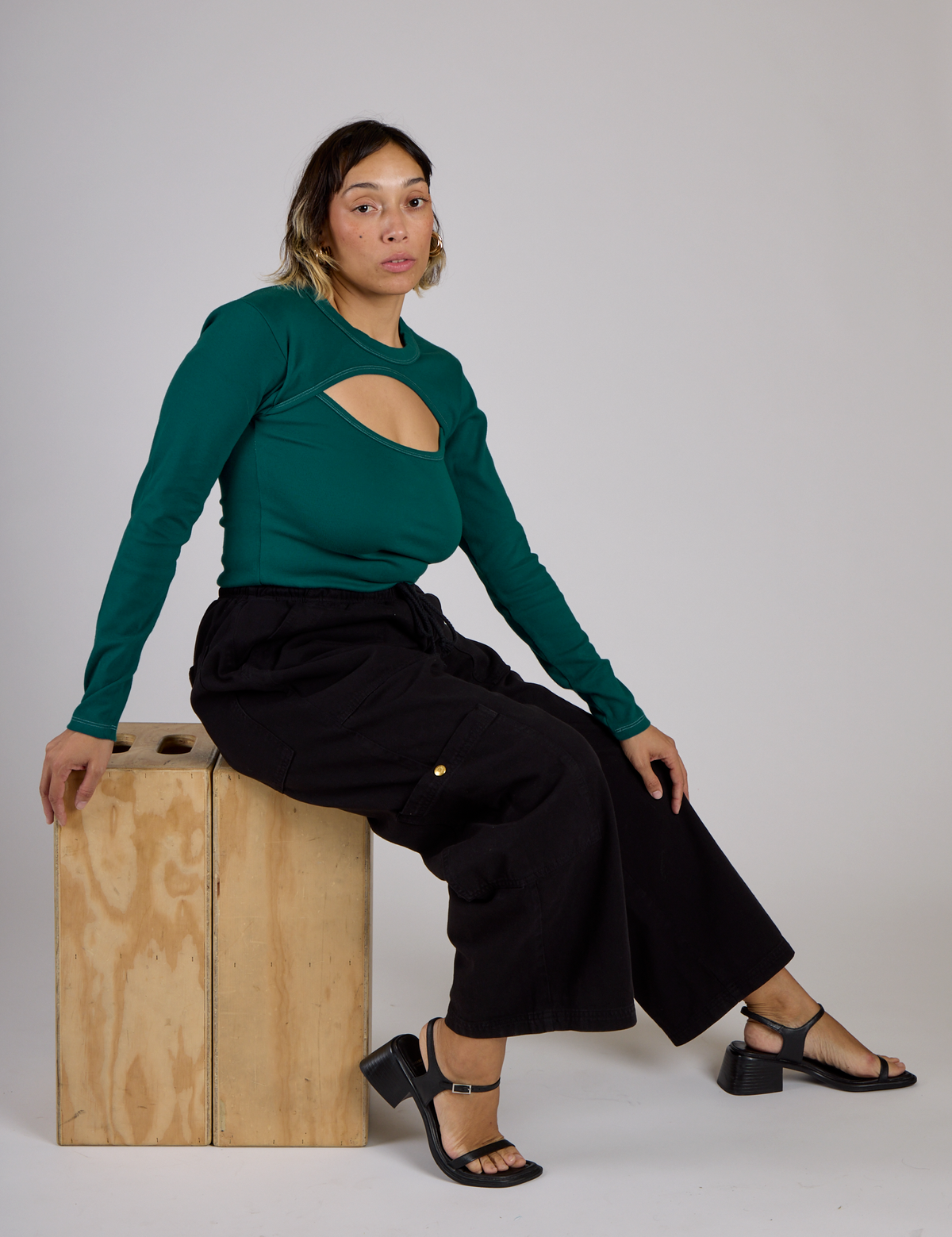 Tiara wearing the Hunter Green Long Sleeve Porthole Tee with lack Drop Pocket Pants