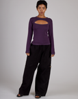 Mika wearing the Nebula Purple Long Sleeve Porthole Tee with Black Drop Pocket Pants