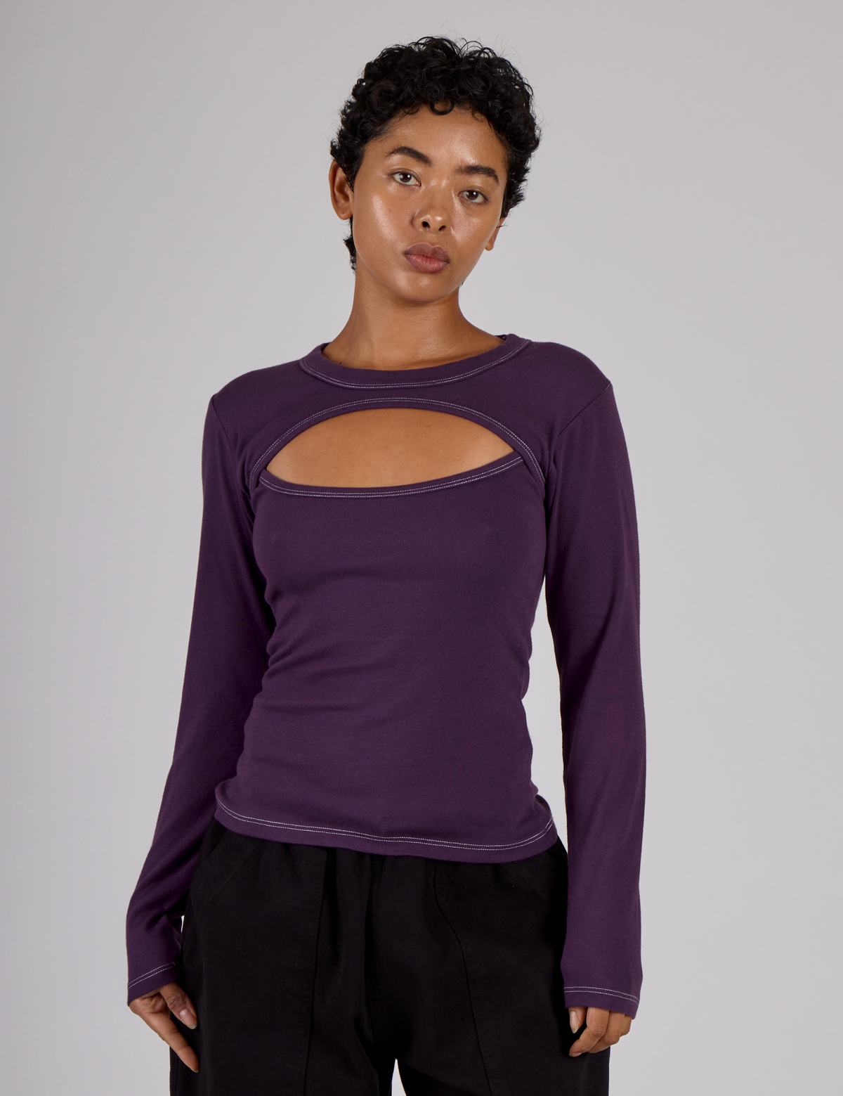 Mika is 5'3" and wearing P Nebula Purple Long Sleeve Porthole Tee