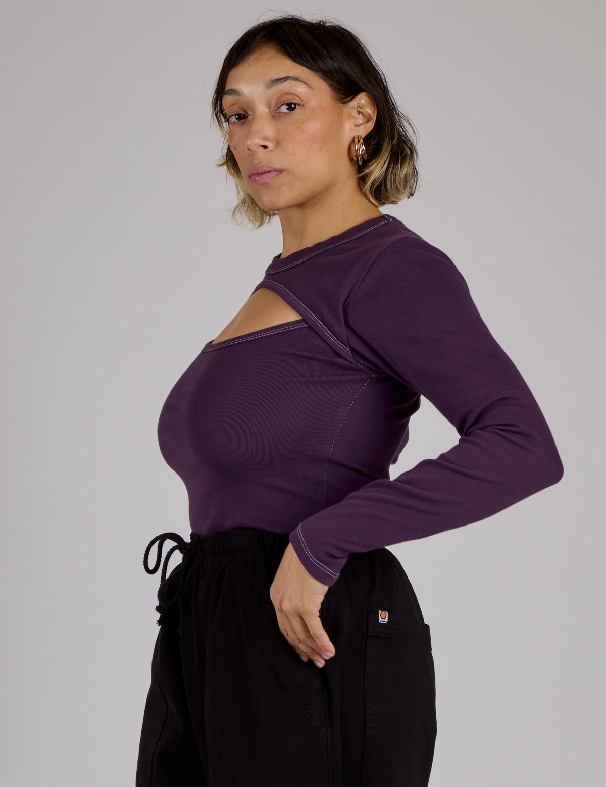 Side view of the Nebula Purple Long Sleeve Porthole Tee on Tiara
