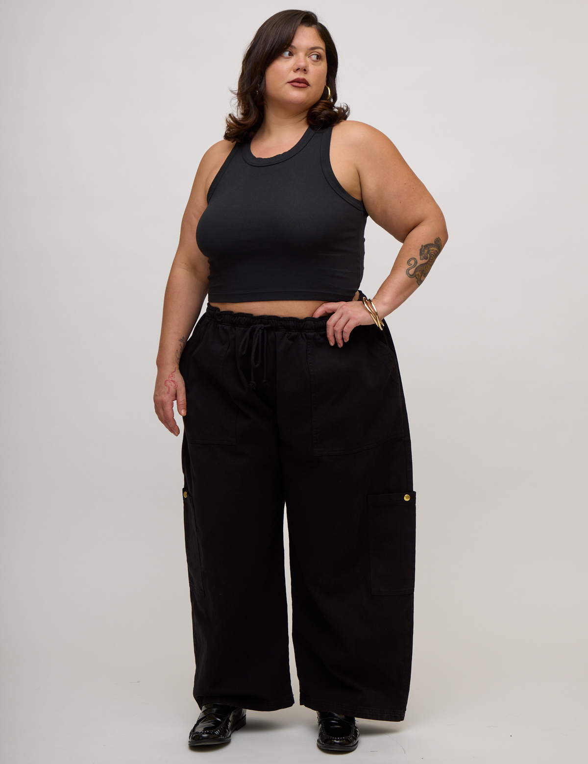 Kristen is 5'9" and wearing L Basic Black Deep Cut Racerback with Black Drop Pocket Pants