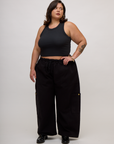 Kristen is 5'9" and wearing L Basic Black Deep Cut Racerback with Black Drop Pocket Pants