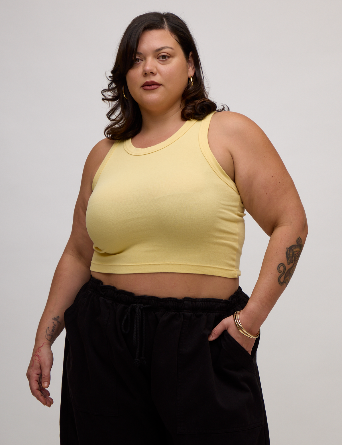Kristen is 5'9" and wearing L Butter Yellow Deep Cut Racerback