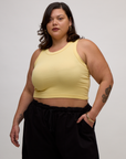 Kristen is 5'9" and wearing L Butter Yellow Deep Cut Racerback