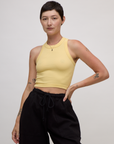 Alex is 5'8" and wearing P Butter Yellow Deep Cut Racerback