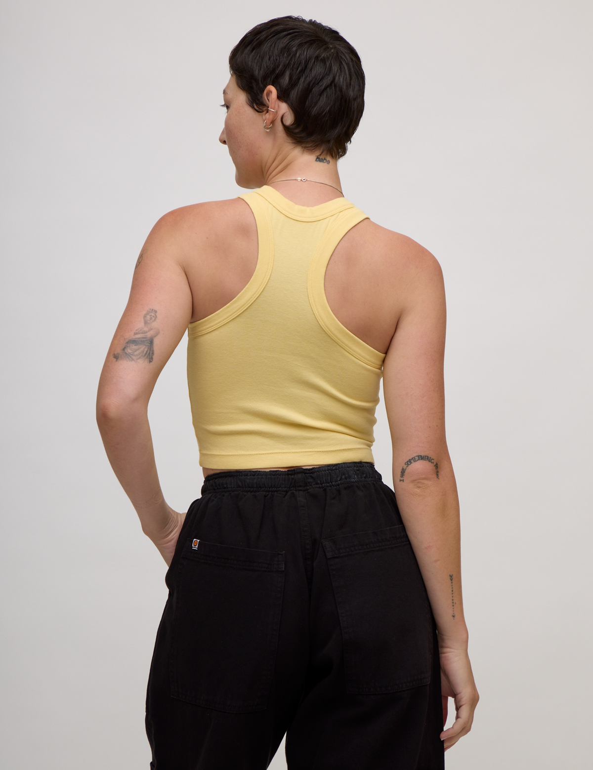 Back view of the Butter Yellow Deep Cut Racerback on Alex