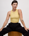 Alex wearing the Butter Yellow Deep Cut Racerback