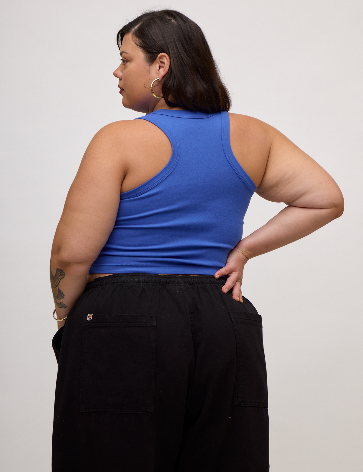 Back view of Kristen in the Cornflower Blue Deep Cut Racerback