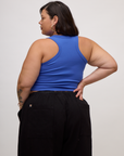 Back view of Kristen in the Cornflower Blue Deep Cut Racerback